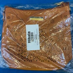 Hibala Brown Laser-Cut Shoulder Bag with a zipper pocket in back pockets inside
